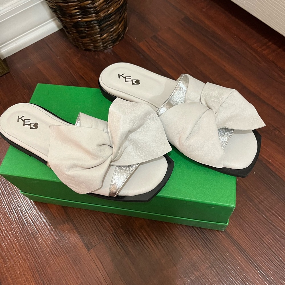 White slide sandals.
